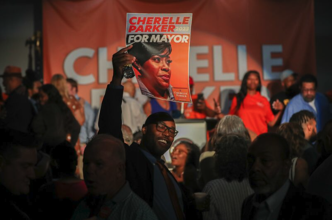 Cherelle Parker supporters hold up her campaign poster at her watch party Tuesday. Parker has won the Democratic nomination for mayor of Philadelphia.
